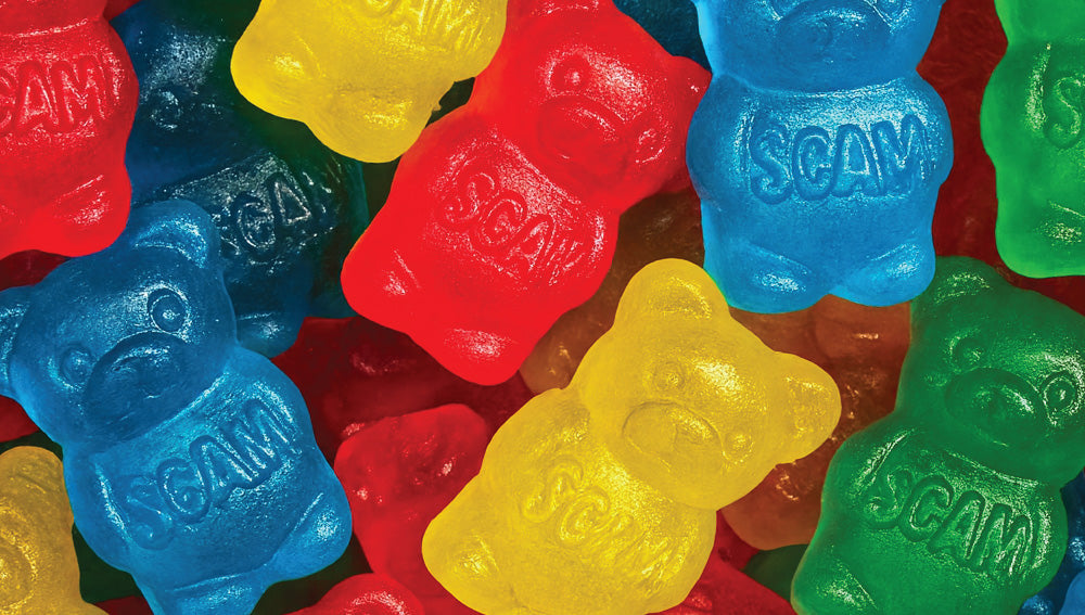 Colorful gummy bears in various shapes and sizes scattered together.